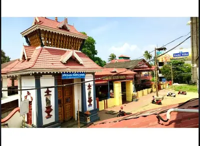 a building with a tower on top of a street at K K Gardens in Palakkad