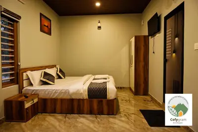 a bedroom with a bed with a wooden frame at Cofygram cottages in Wayanad