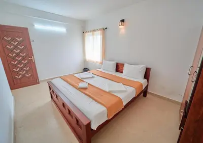 a bedroom with a large bed in a room at Cucuu Nest Villa Coonoor by VOYE HOMES - Surrounded by Tea Plantations in Coonoor