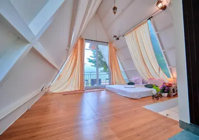 a large room with a bed and a large window at Cucuu Nest Villa Coonoor by VOYE HOMES - Surrounded by Tea Plantations in Coonoor