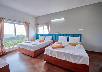 two beds in a room with two windows at Cucuu Nest Villa Coonoor by VOYE HOMES - Surrounded by Tea Plantations in Coonoor