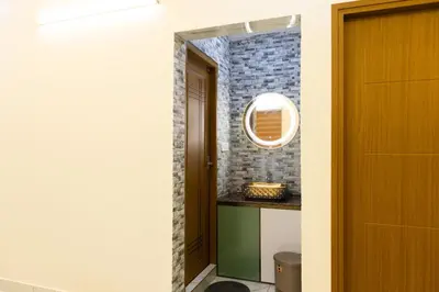 a hallway with a door and a mirror at Nutmeg Farmstay with Pool, Vadakkencherry, Palakkad in Vadakkāncheri