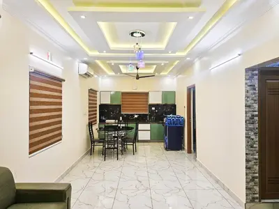a dining room and kitchen with a table and chairs at Nutmeg Farmstay with Pool, Vadakkencherry, Palakkad in Vadakkāncheri