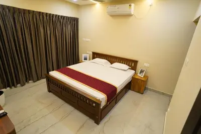 a bedroom with a bed and a window at Elephant Village Private Pool Villa in Munnar
