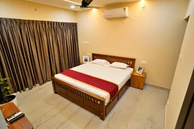 a bedroom with a bed and a window at Elephant Village Private Pool Villa in Munnar