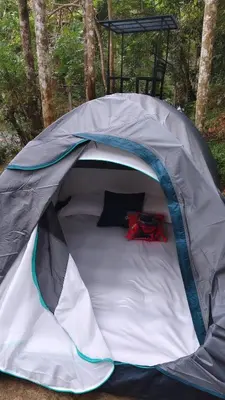 a tent with a bed in the middle at SR Villa - Serenity by riverside in Meppādi
