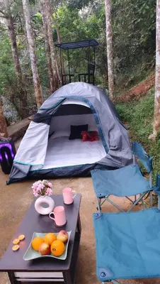 a tent with a table with fruit on it at SR Villa - Serenity by riverside in Meppādi