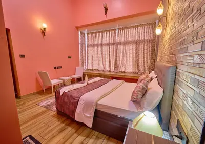 a bedroom with a large bed and a window at EMYs Misty Charm Private Villa Ooty by VOYE HOMES in Ooty