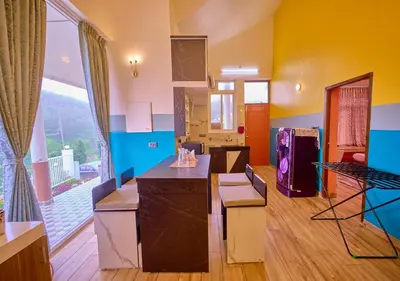 a room with a kitchen with a large window at EMYs Misty Charm Private Villa Ooty by VOYE HOMES in Ooty
