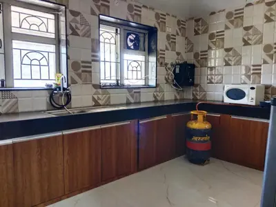 a kitchen with a fire hydrant in the middle of it at The silver dale homestay 1 in Ooty