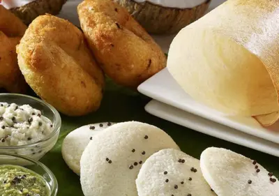 a group of breads and dips on a table at Palatty's Resorts in Athirappally