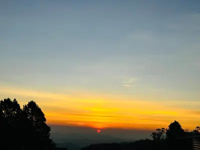 a sunset with the sun in the sky at Sunrise Peak View in Lovedale