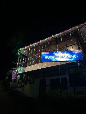 a building with christmas lights on top of it at GV Royal Residency Vattavada in Vattavada