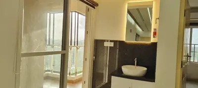 a bathroom with a sink and a mirror at 3 Bedroom River view apartment in Aluva, near Cochin Airport in Alwaye