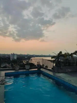 a swimming pool on the roof of a building at 3 Bedroom River view apartment in Aluva, near Cochin Airport in Alwaye
