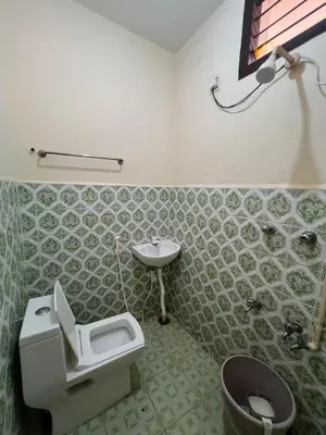 a bathroom with a toilet and a sink at SHI's 2bhk Near Ganga Hospital in Coimbatore