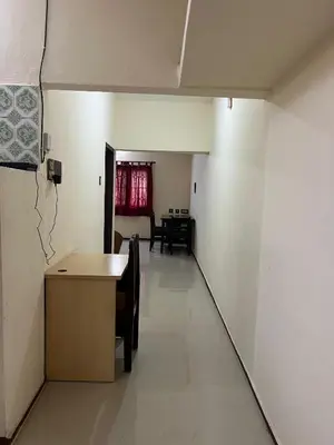 a room with a table and chairs and a dining room at SHI's 2bhk Near Ganga Hospital in Coimbatore