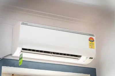 a white air conditioner in a ceiling at Leo Vishroam in Mysore