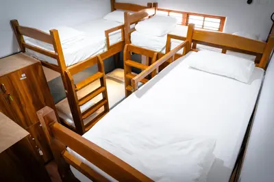 an overhead view of a dorm room with three bunk beds at Leo Vishroam in Mysore