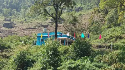 a house on the side of a hill at Aamis Home Stay in Vattavada