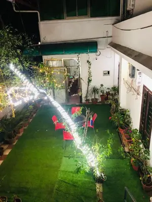 an overhead view of a garden with chairs and lights at Ghala Residency in Munnar