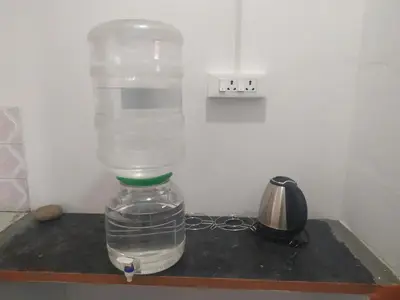 a bottle of water sitting on top of a counter at Mithu's Nest-Ur Holiday Abode in Coimbatore