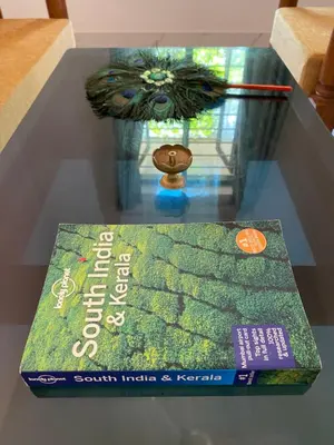 a book sitting on top of a table at Gaya beach hacienda in Irimbranallūr