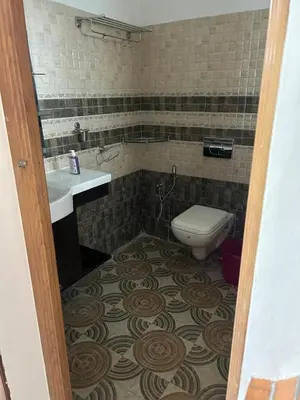 a bathroom with a toilet and a sink at Mountain Breeze Resort Vattavada in Munnar