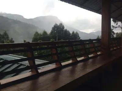 a balcony with a view of the mountains at Mountain Breeze Resort Vattavada in Munnar