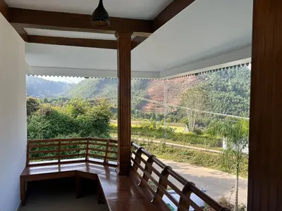 a balcony with a view of a mountain at Mountain Breeze Resort Vattavada in Munnar