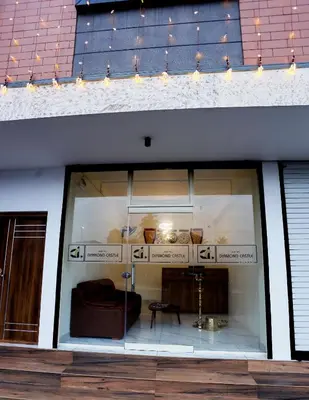 a window of a store with a couch in it at Hotel Diamond Castle in Manjeri
