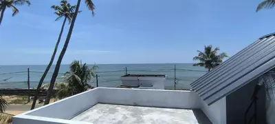 a view of the ocean from a house at Sea Breeze Cherai Homestay in Pallipuram