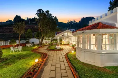 an image of a house with a garden at Tiverton Bungalow in Ooty