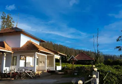 a house with bikes parked in front of it at Green Leaves The Countryside Inn in Ooty
