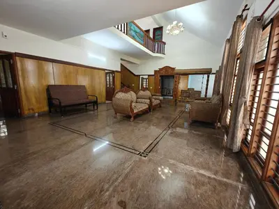 a living room with couches and chairs in a building at 6bhk Luxury Villa in Mysore
