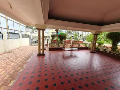 an empty lobby with a red and blue tile floor at 6bhk Luxury Villa in Mysore