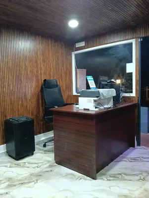 an office with a desk with a computer and a chair at Longwood Resorts in Kotagiri