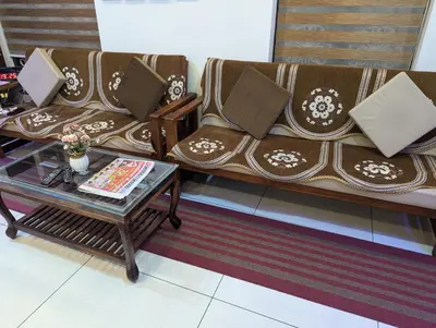 a living room with a couch and a coffee table at Nadavayal Villa in Wayanad