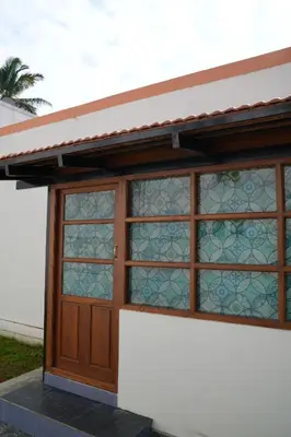 a building with a door with stained glass at Perfect Gateway in Mysore