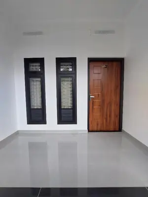 three doors in a white room with at Achandy Arcade in Kakkadampoyil