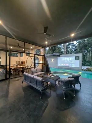 a living room with a pool table and a tv at Earthsong & Birdsong Luxury Pool Villa by Luxunlock Private Villas in Suntikoppa