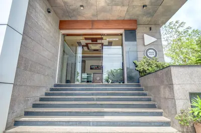 a set of stairs leading to a building at Hotel J N Stay Mysore - 12 Minutes to Mysore Palace in Mysore