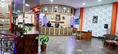 a lobby of a store with a bar in it at The Monarch in Ooty
