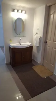 a bathroom with a sink and a mirror at Atlas Celestial Park in Nedumbassery