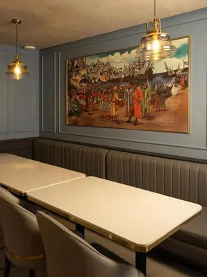 a meeting room with a painting on the wall at Sanketam Motel in Calicut