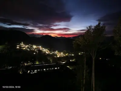a view of a city at night with lights at May Fair Vista Luxury Villa - Huge Lawn - Scenic Views - Free Parking in Kotagiri