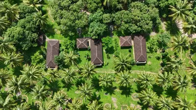 an overhead view of a resort with trees and bushes at Down to Earth Farmstay by LAKSEM in Anaimalai