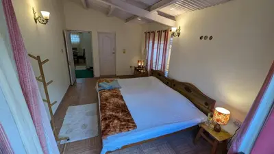 an overhead view of a bedroom with a large bed at Yellow House Kotagiri in Kotagiri