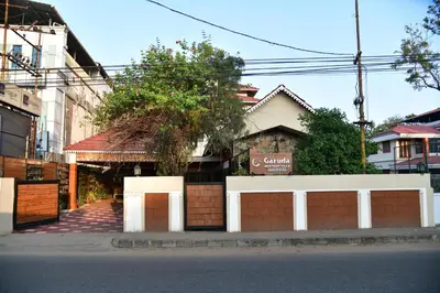 a building on the side of a street at Garuda Luxury Bungalow in Trichūr