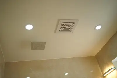a bathroom with two recessed lights on the ceiling at Golden Sands Cherai in Cherai Beach